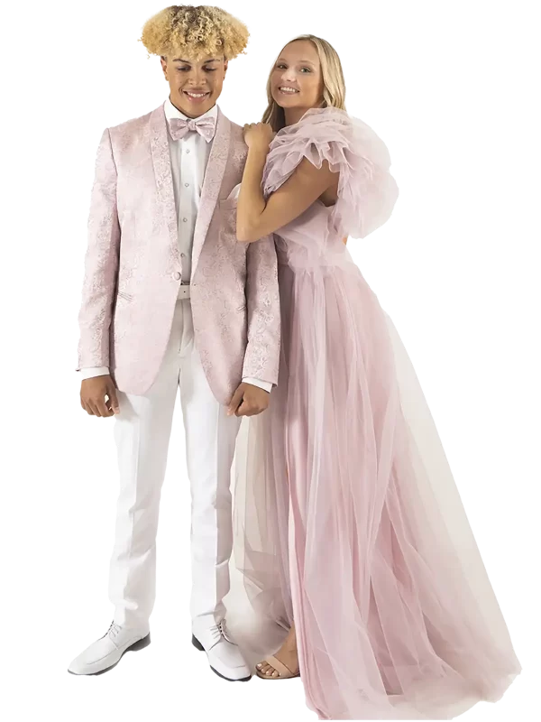 Young man in a pink quartz paisley jacket and white pants with a girl in a pink dress